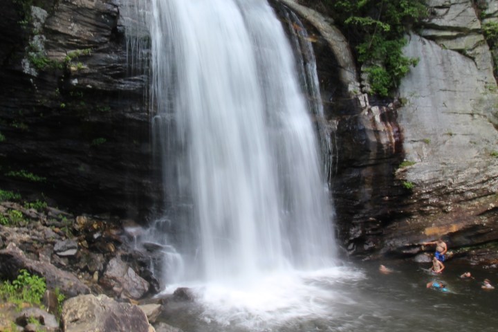 a large waterfall over some water