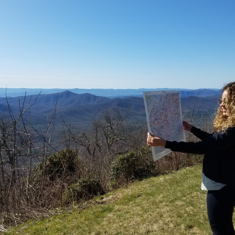 Guest admires our topo maps from the Blue Ridge Parkway