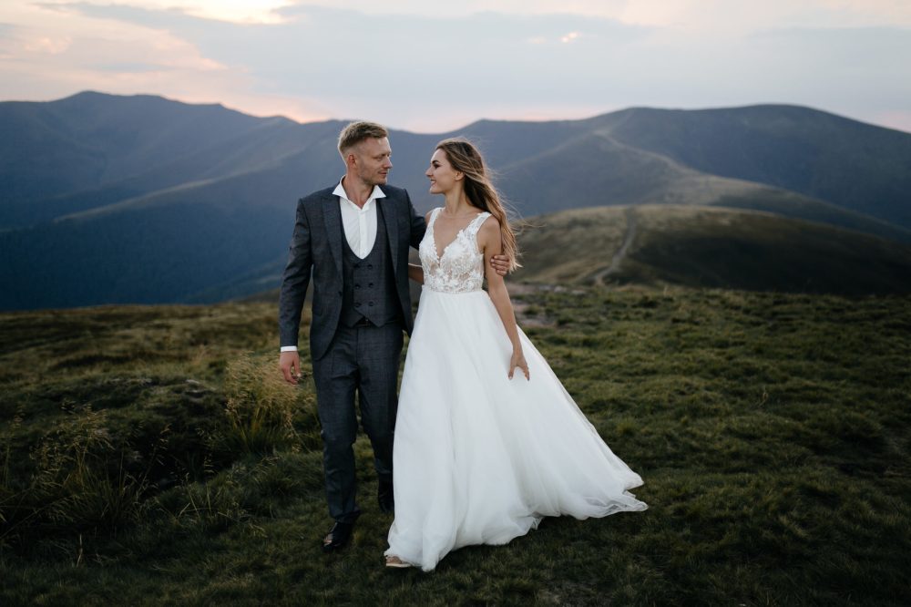 a person standing in front of a mountain