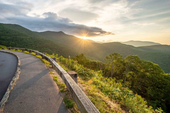 Scenic drive from Lane Pinnacle Overlook on Blue Ridge Parkway a a path with trees on the side of a mountain road