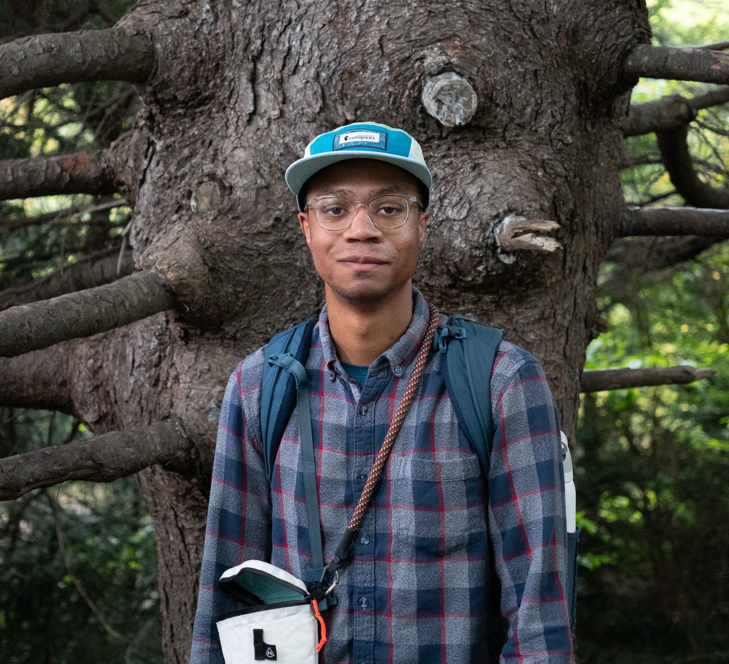 Cuba Gooding Jr. standing in front of a tree