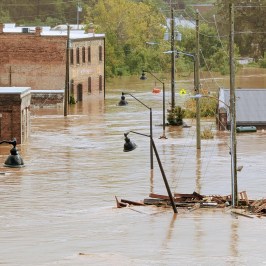 a group of people sitting at a dock