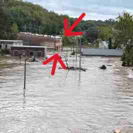 a sign above a body of water
